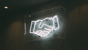 human handshake neon signage