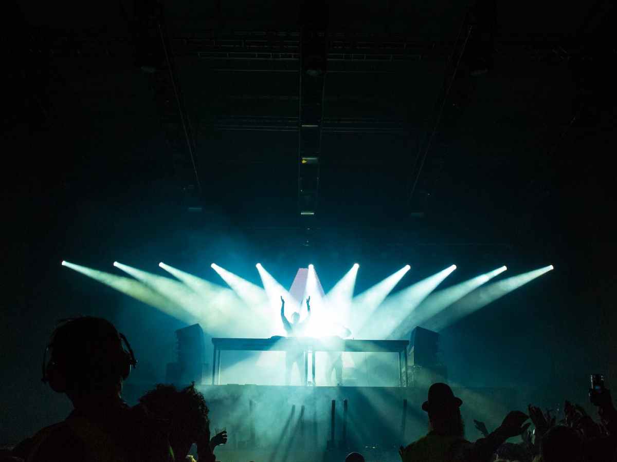 people inside dark room with spotlights